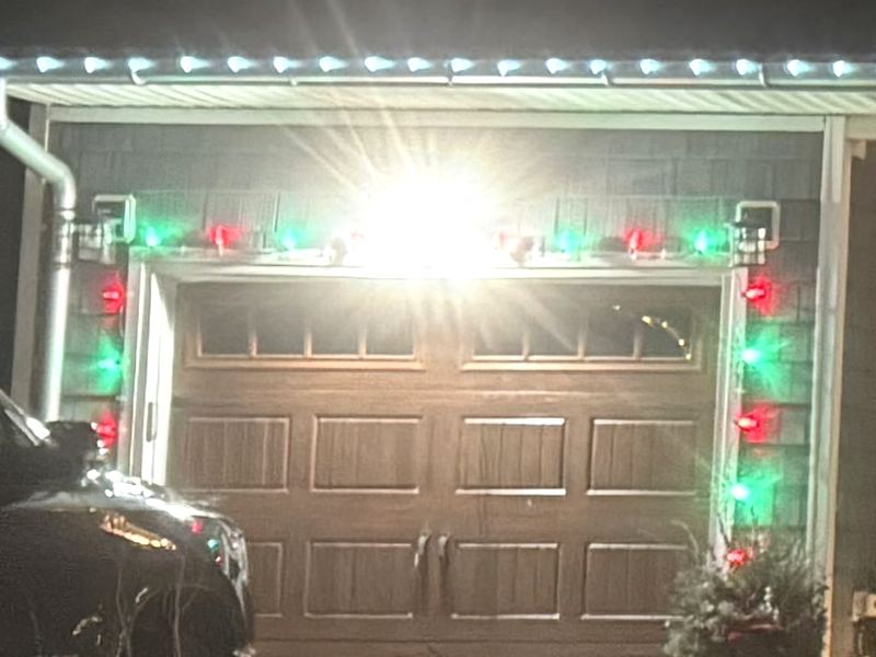 Red and green lights around a garage door