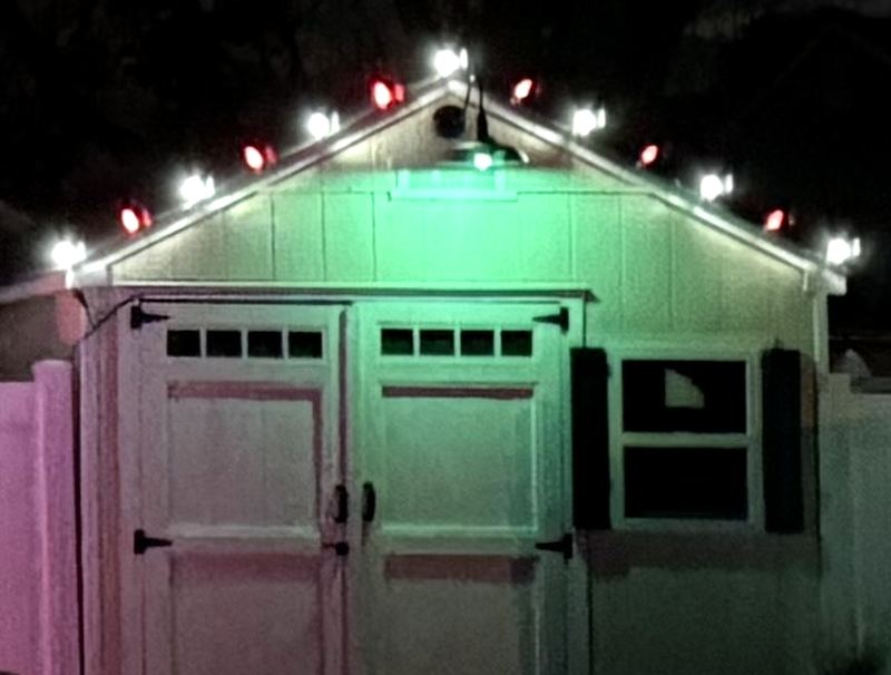 Red and white lights on a shed roofline