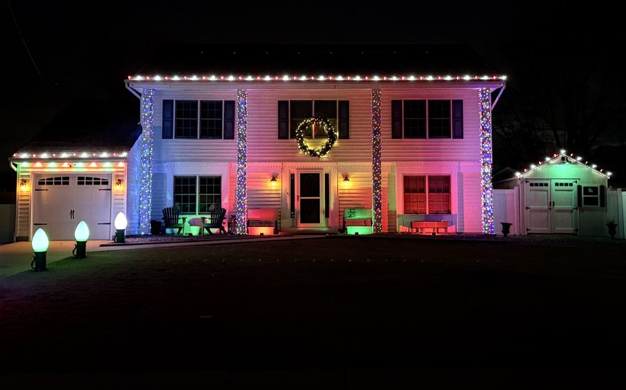 Two-story home with roofline lights